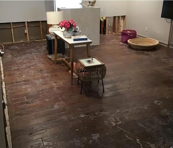 Water loss leaves wood floors stained and requires us to remove lower drywall.